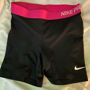 black nike pros with pink band